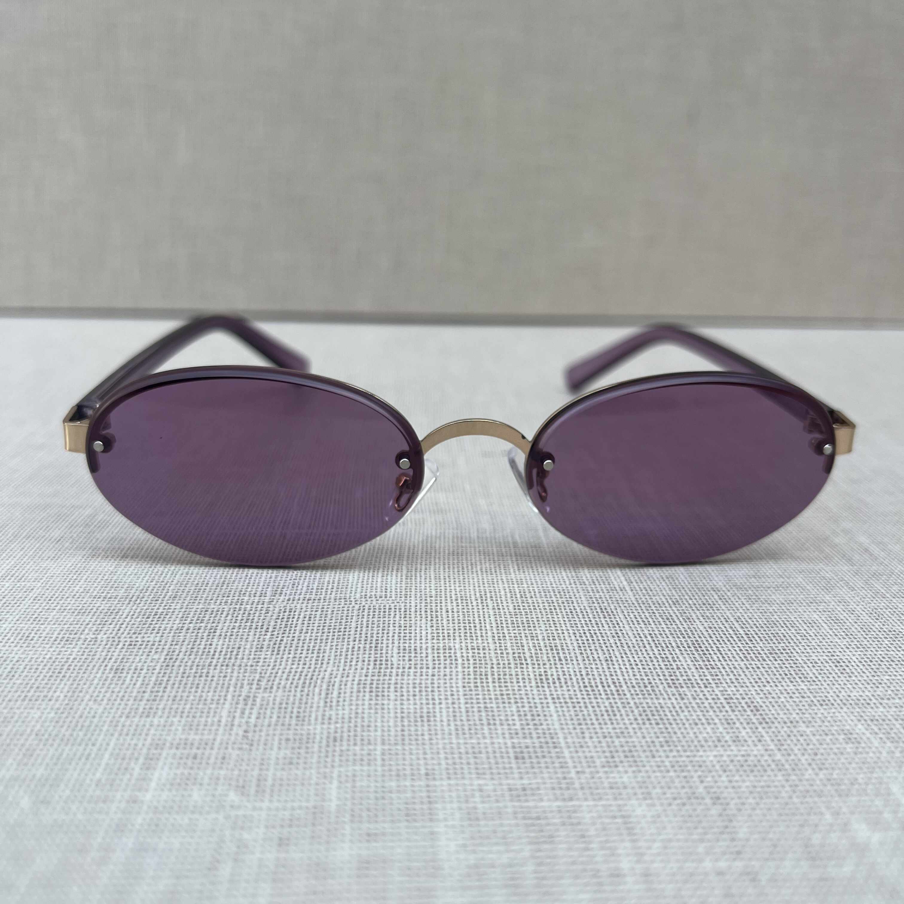 Purple Rimless Oval Sunglasses